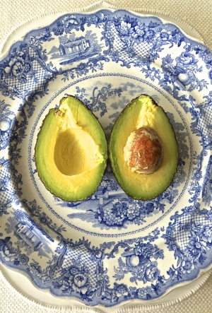 avocado on a blue platter